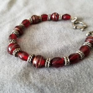Red beaded bracelet with silver accents
